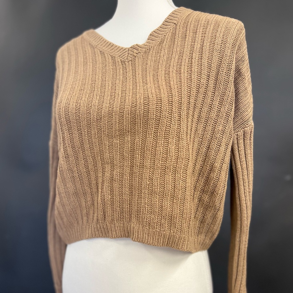 Brown/tan colored sweater. Looks reversible but I found that it is not.